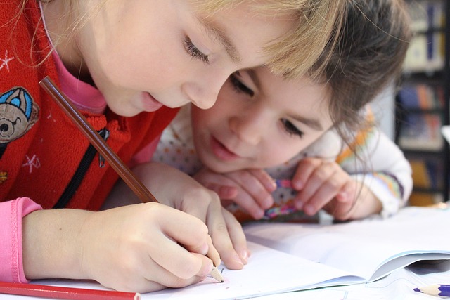 Two Children Doing Some Drawing